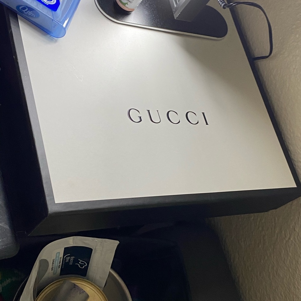 Gucci shopping bags & two duster bags.